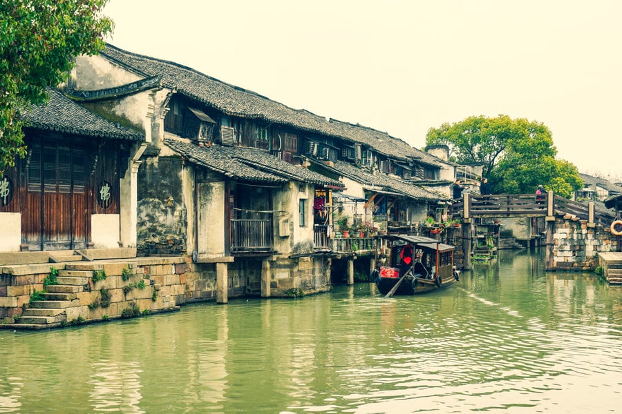 Historic waterside buildings beside a canal in Wuzhen’s Dongzha Scenic Area