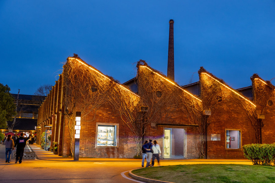 Illuminated red-brick buildings at Taoxichuan in Jingdezhen at dusk