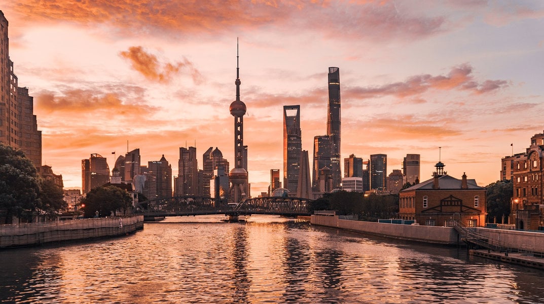 Lujiazui skyline glowing at sunset in Shanghai