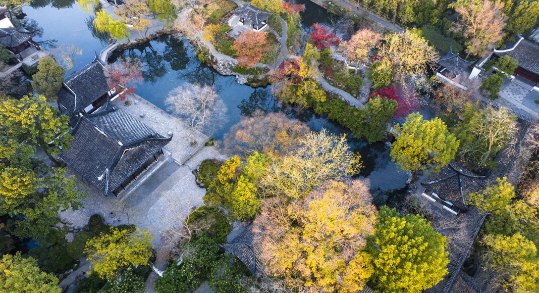Garden buildings among autumn trees at the Humble Administrator’s Garden in Suzhou.