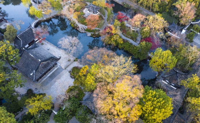 Garden buildings among autumn trees at the Humble Administrator’s Garden in Suzhou.