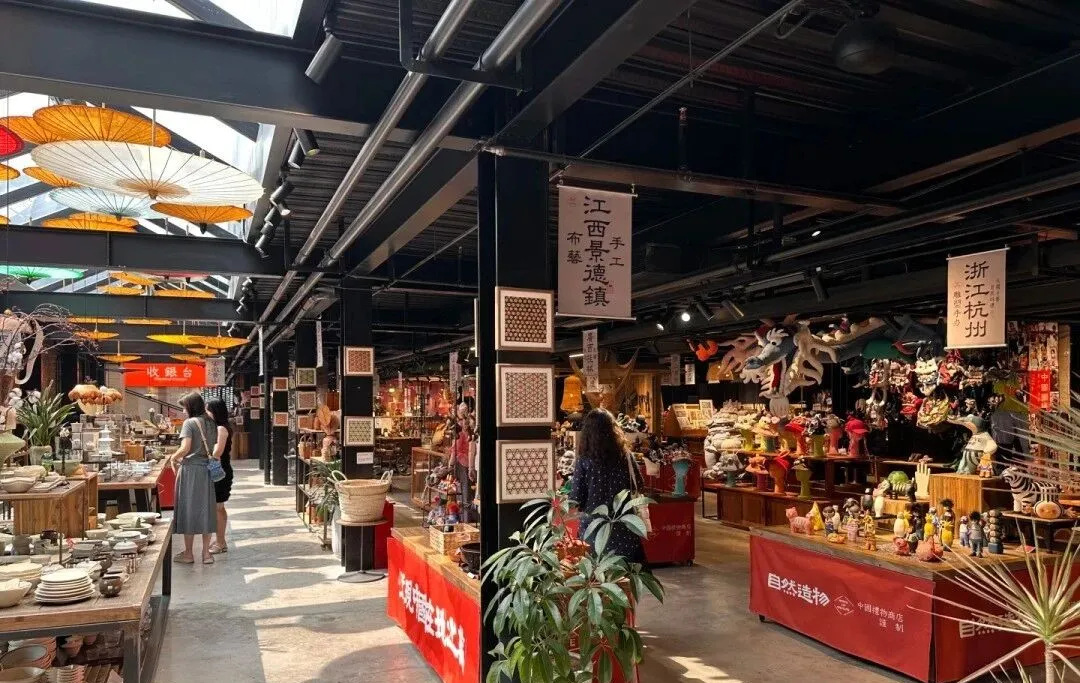 Sunlight falling across handmade ceramics and craft displays inside the centre